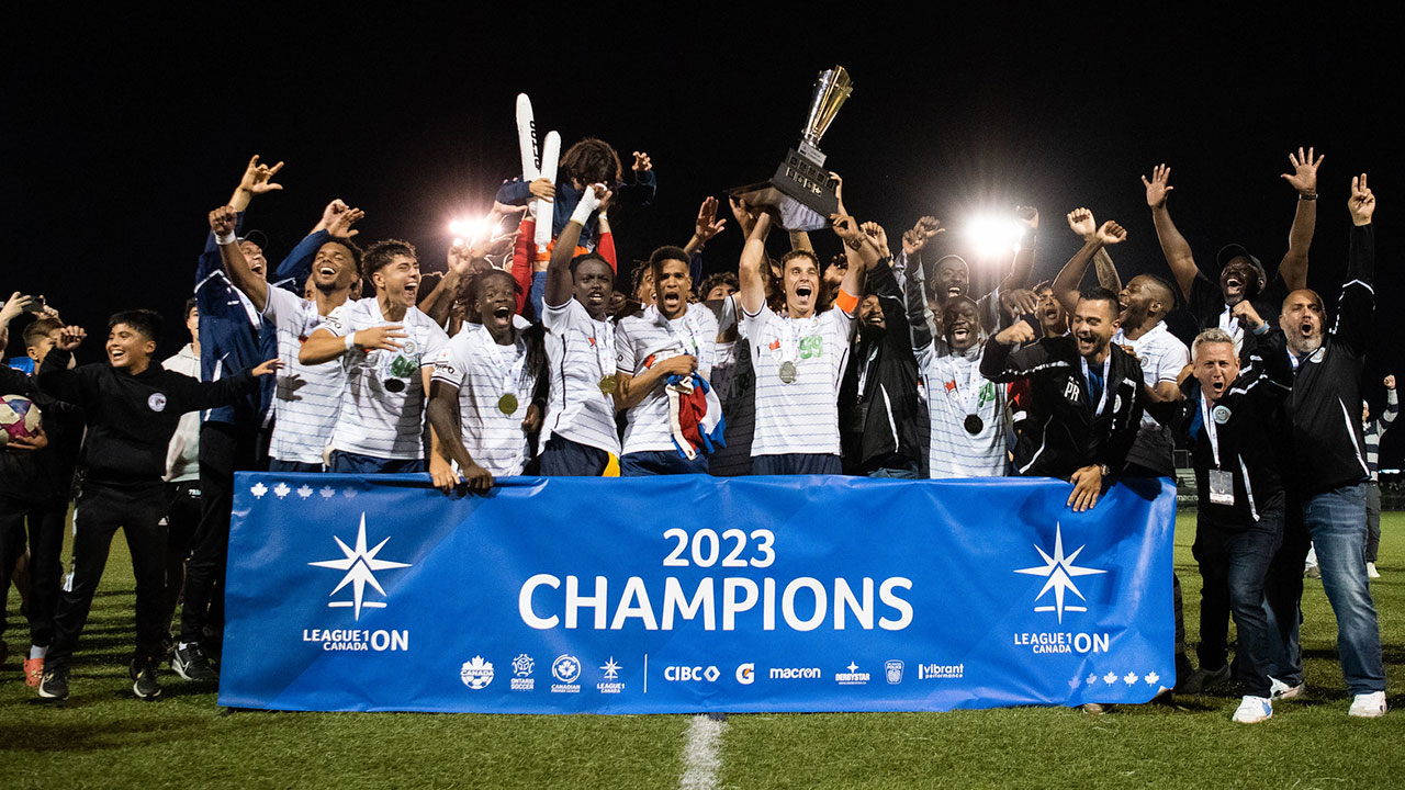 The Simcoe County Rovers hoisting the League1 Ontario trophy (Photo credit: Martin Bazyl / League1 Ontario)